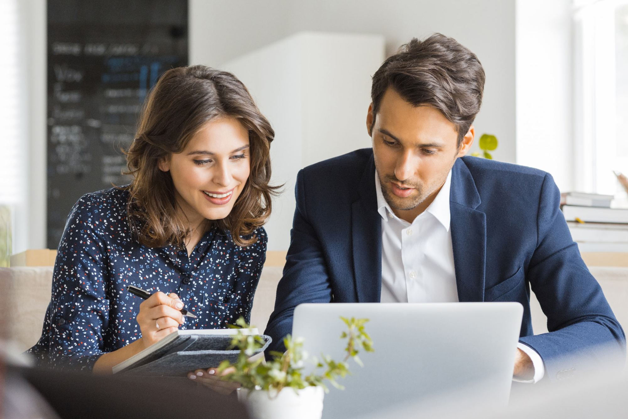 A man and a woman analyse a digital marketing strategy